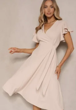 Beżowa Kopertowa Sukienka z Rozkloszowanym Dołem i Ozdobnym Wiązaniem Dannola