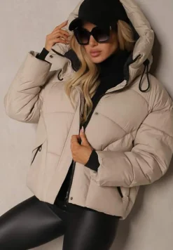 Beżowa Pudełkowa Kurtka z Pikowanymi Przeszyciami i Kapturem Zdobiona Ściągaczami Hedilea