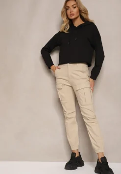 Beżowe Jeansy z Bawełny o Kroju Joggerów z Ozdobnymi Kieszeniami i Gumką w Pasie Unicella