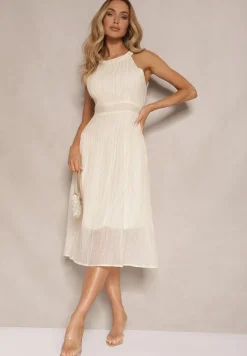 Jasnobeżowa Sukienka o Rozkloszowanym Kroju z Wiązaniem Zdobiona Tłoczeniem Nimirelle