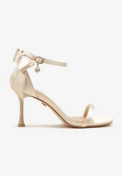 Złote Sandały Vices na Szpilce Ozdobione Kokardą Sarazelle