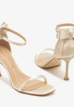 Złote Sandały Vices na Szpilce Ozdobione Kokardą Sarazelle